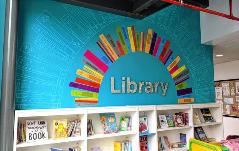 An image of a curved bookshelf wall graphic.
